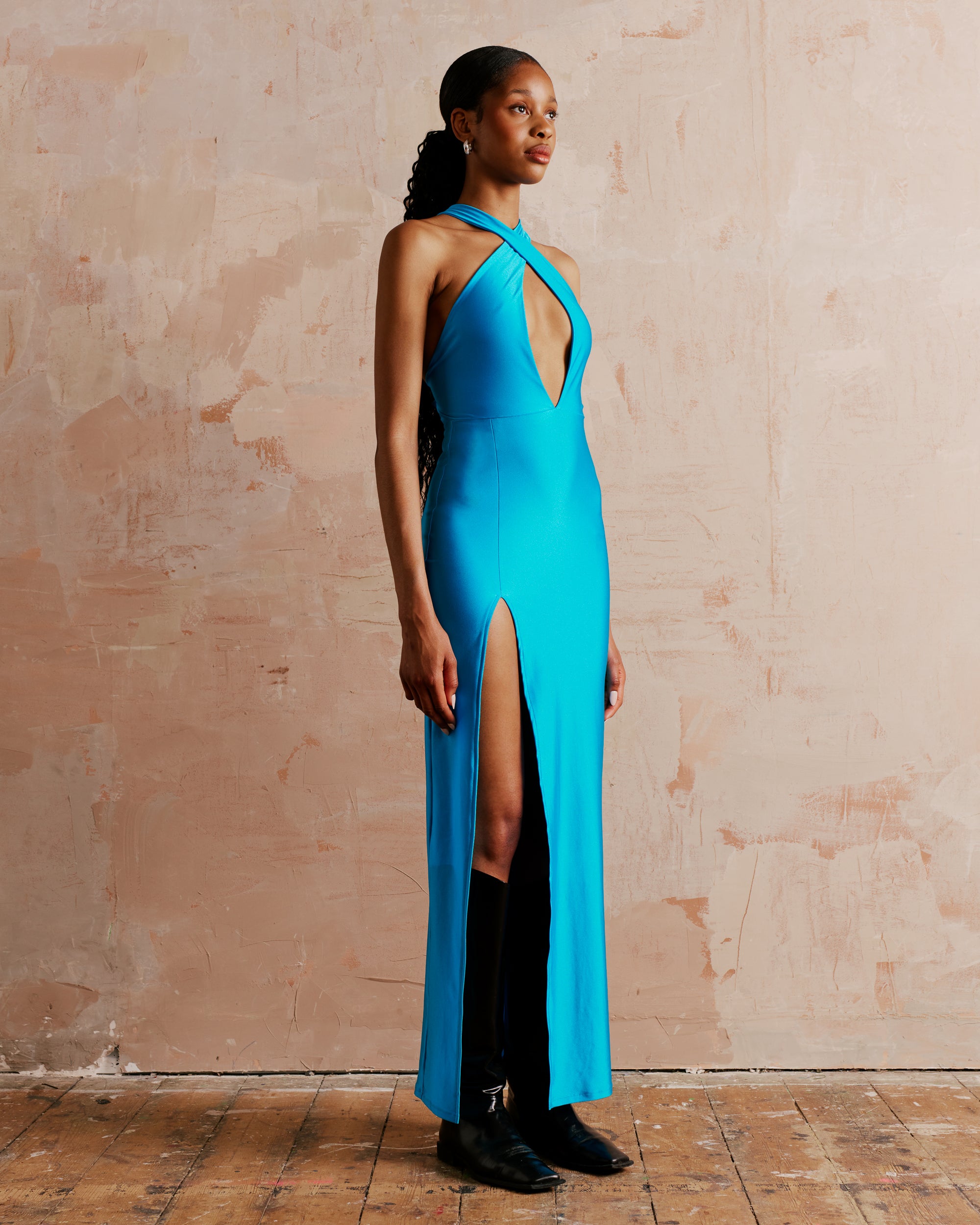 Halter neck maxi dress with a high split and open back in turquoise, perfect cocktail dress for a special occasion